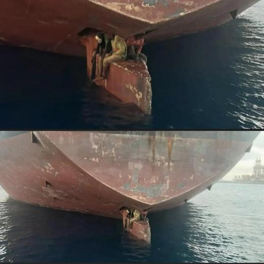 These three men sat on a ship's rudder